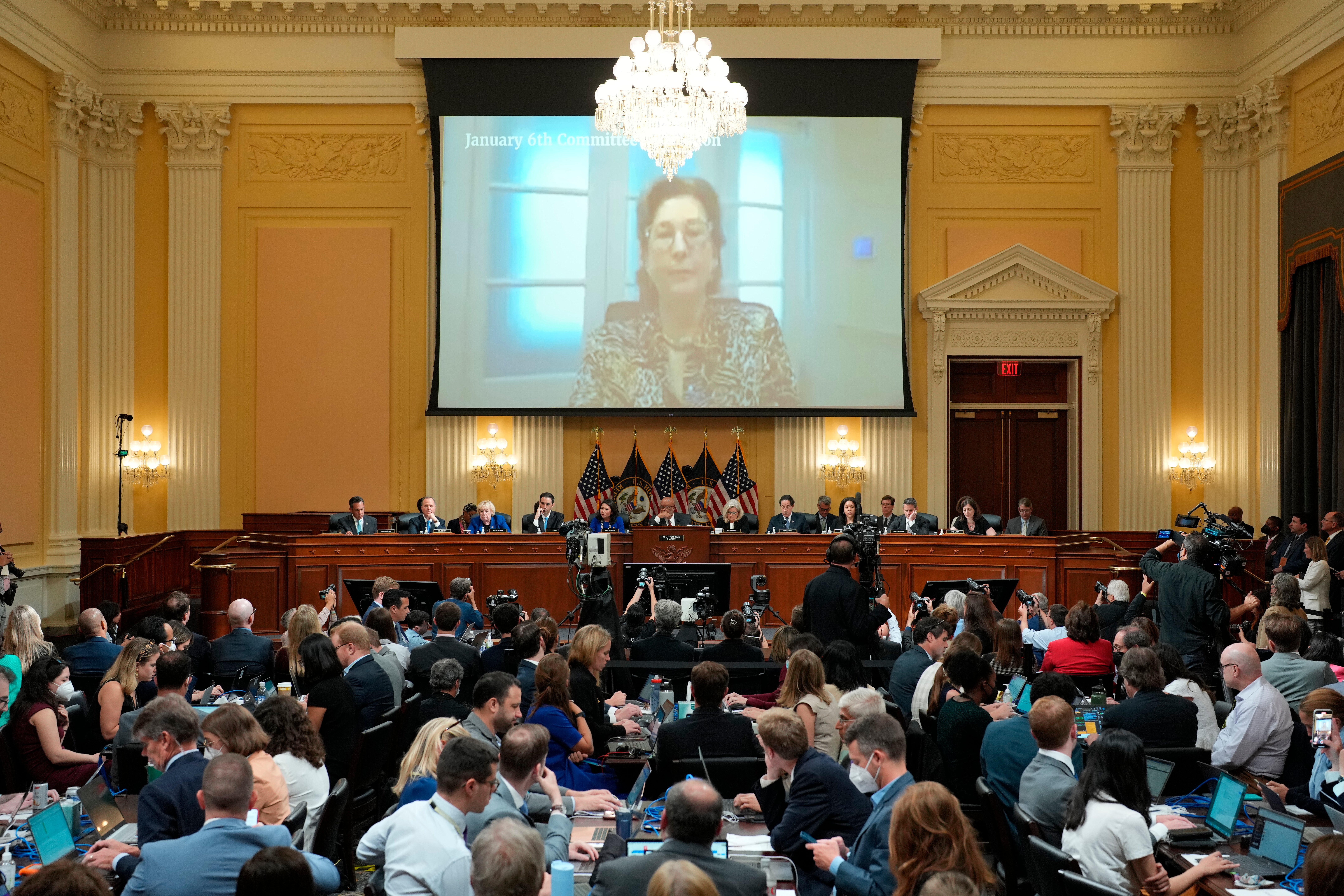 A video of Sidney Powell is seen on a screen as the House select committee investigating the Jan. 6 attack on the US Capitol holds a hearing at the Capitol in Washington, Tuesday, July 12, 2022