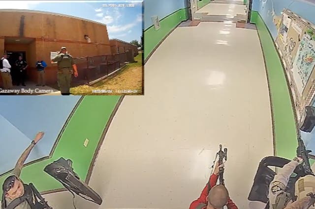 <p>Surveillance camera video from a hallway in Robb Elementary School shows the confusion on 24 May inside the Uvalde school as officers wait outside the classrooms where a gunman attacked students and teachers</p>