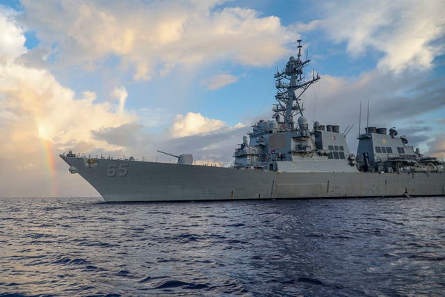 <p>In this photo provided by US Navy, guided-missile destroyer USS Benfold conducts routine underway operations in the Philippines Sea on 24 June 2022 </p>