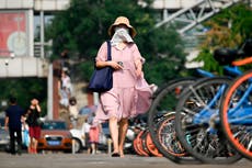 Red alert in China after record breaking high temperatures and relentless rains wreak havoc