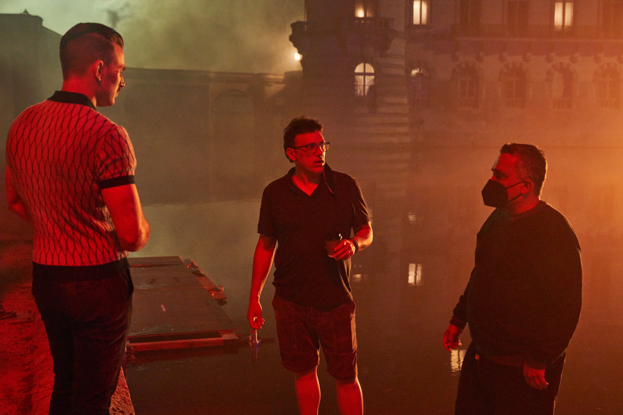 Chris Evans (left) as Lloyd Hansen with directors Anthony and Joe Russo on the set of ‘The Gray Man’