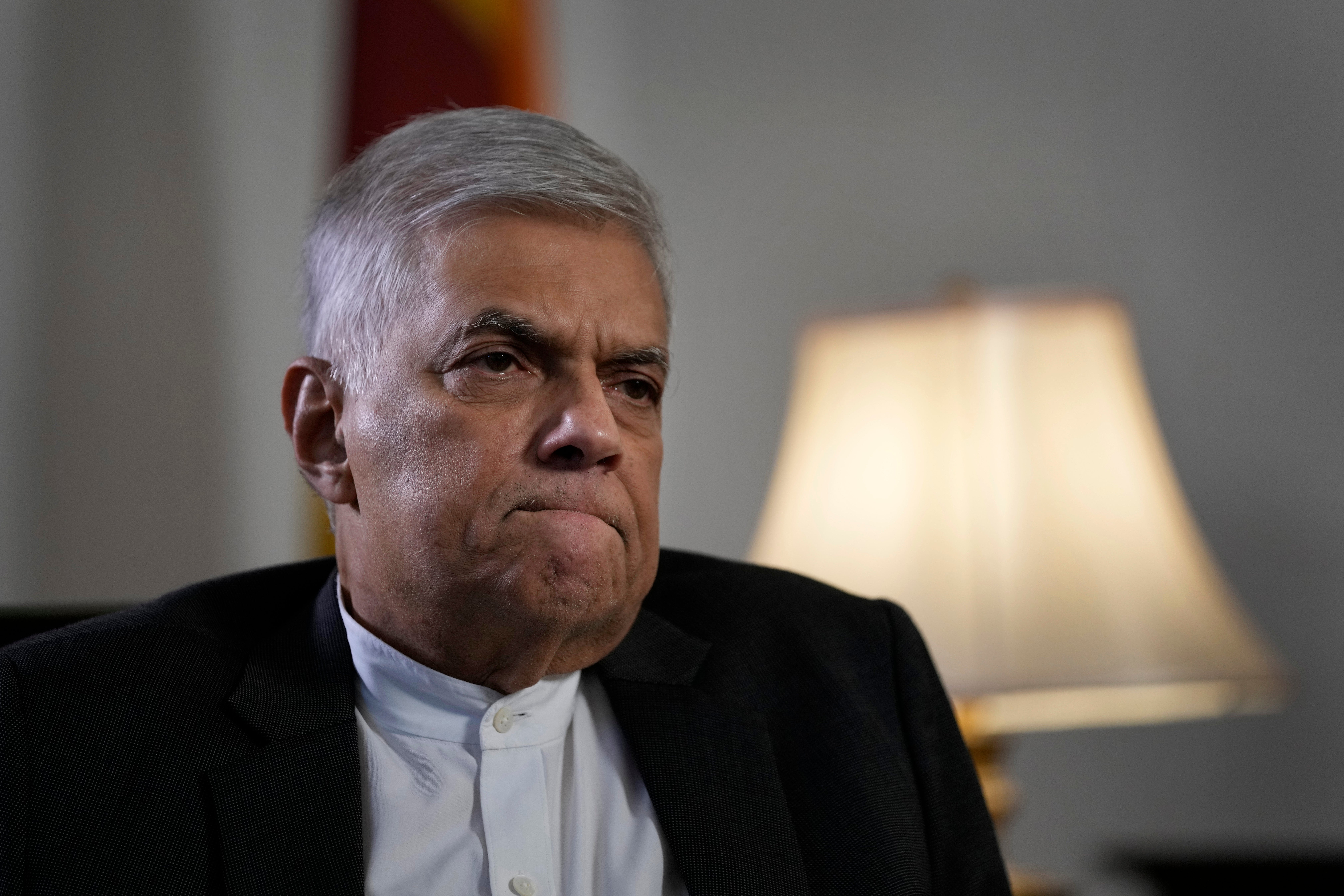 Ranil Wickremesinghe gestures during an interview with The Associated Press in Colombo on 11 June