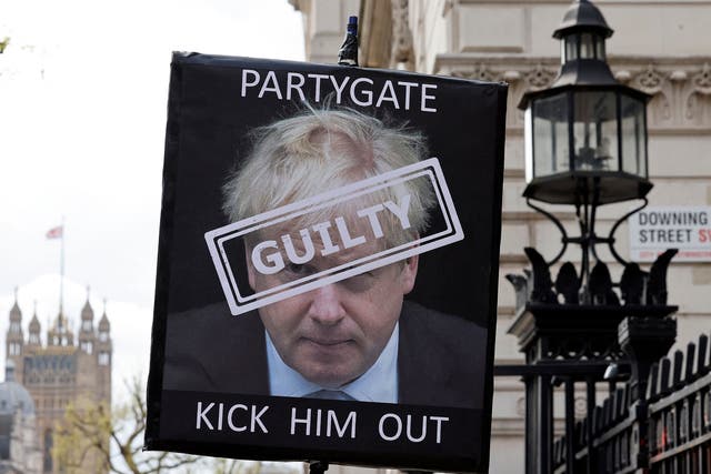<p>A placard calling for Boris Johnson to resign after the Partygate revelations </p>