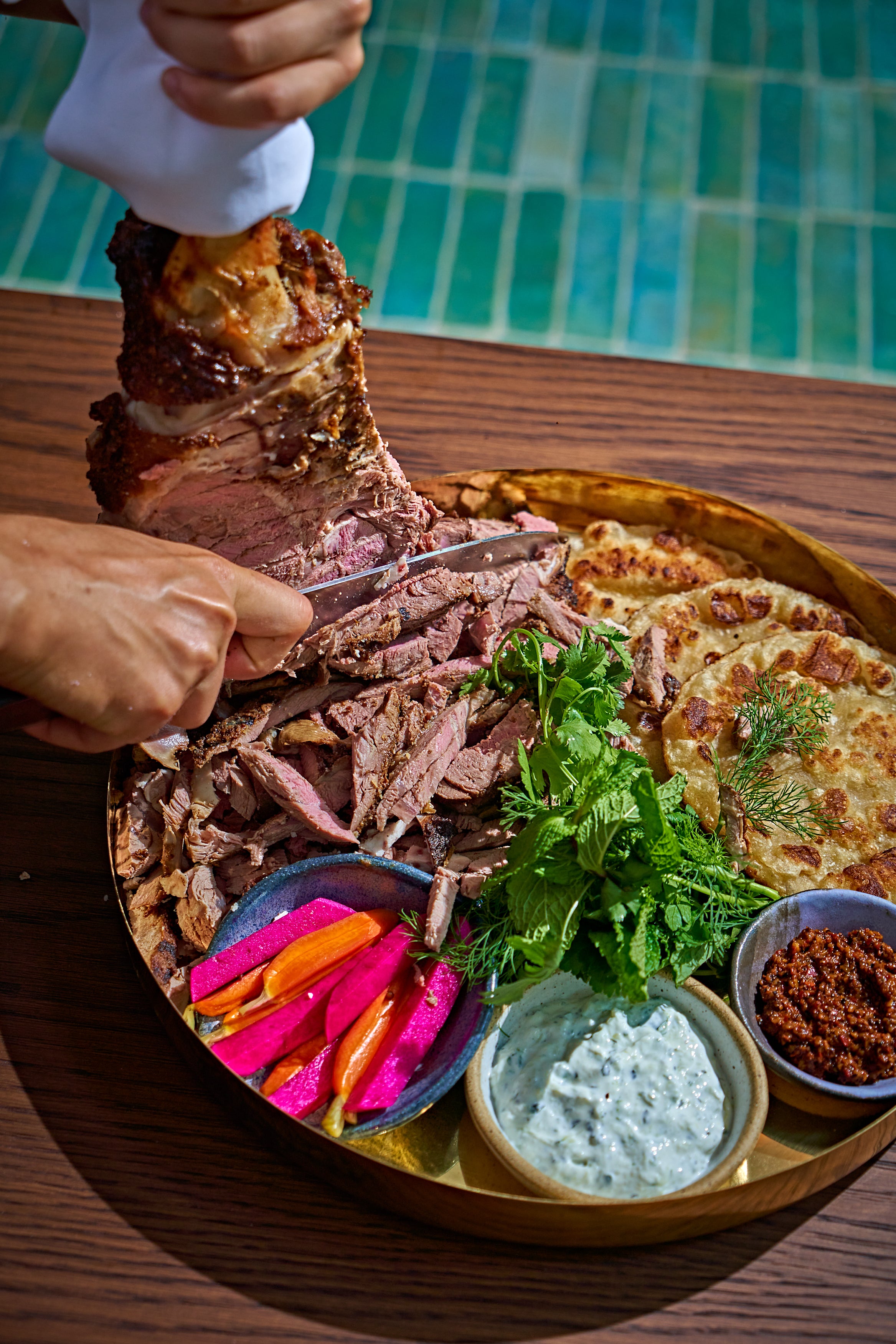 There’s elements of showmanship, for example fire-roasted leg of lamb is shaved onto the plate at your table