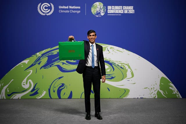 <p>Rishi Sunak arrives at Cop 26 in Glasgow with his green budget box where he lead finance day</p>