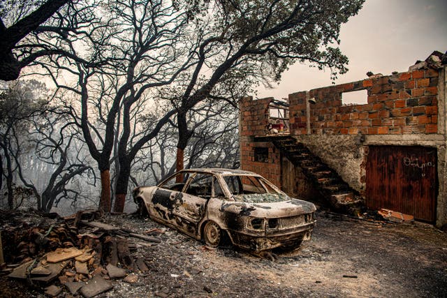 <p>This photograph shows a car and burnt house at Ansiao in Pombal, Portugal</p>