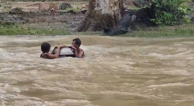 <p>The video shows the family of three sailing away downstream, with the pot acting as vessel and float</p>