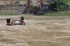 Viral video from flood-hit Indian state shows family crossing river with child inside cooking pot