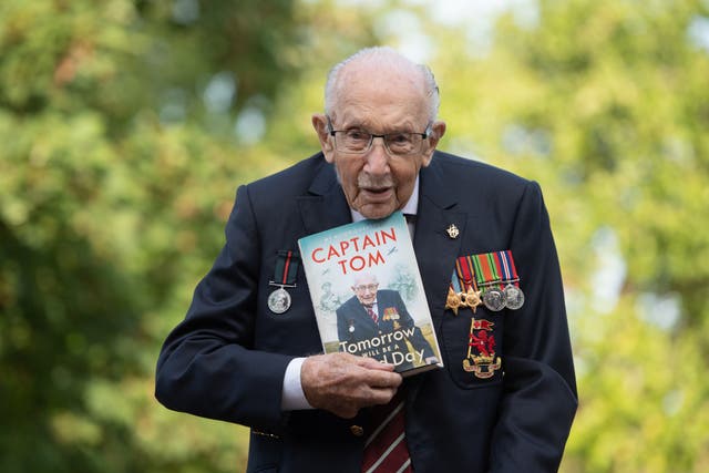 <p>Sir Captain Tom Moore with his autobiography Tomorrow Will Be A Good Day, published in September 2020 </p>