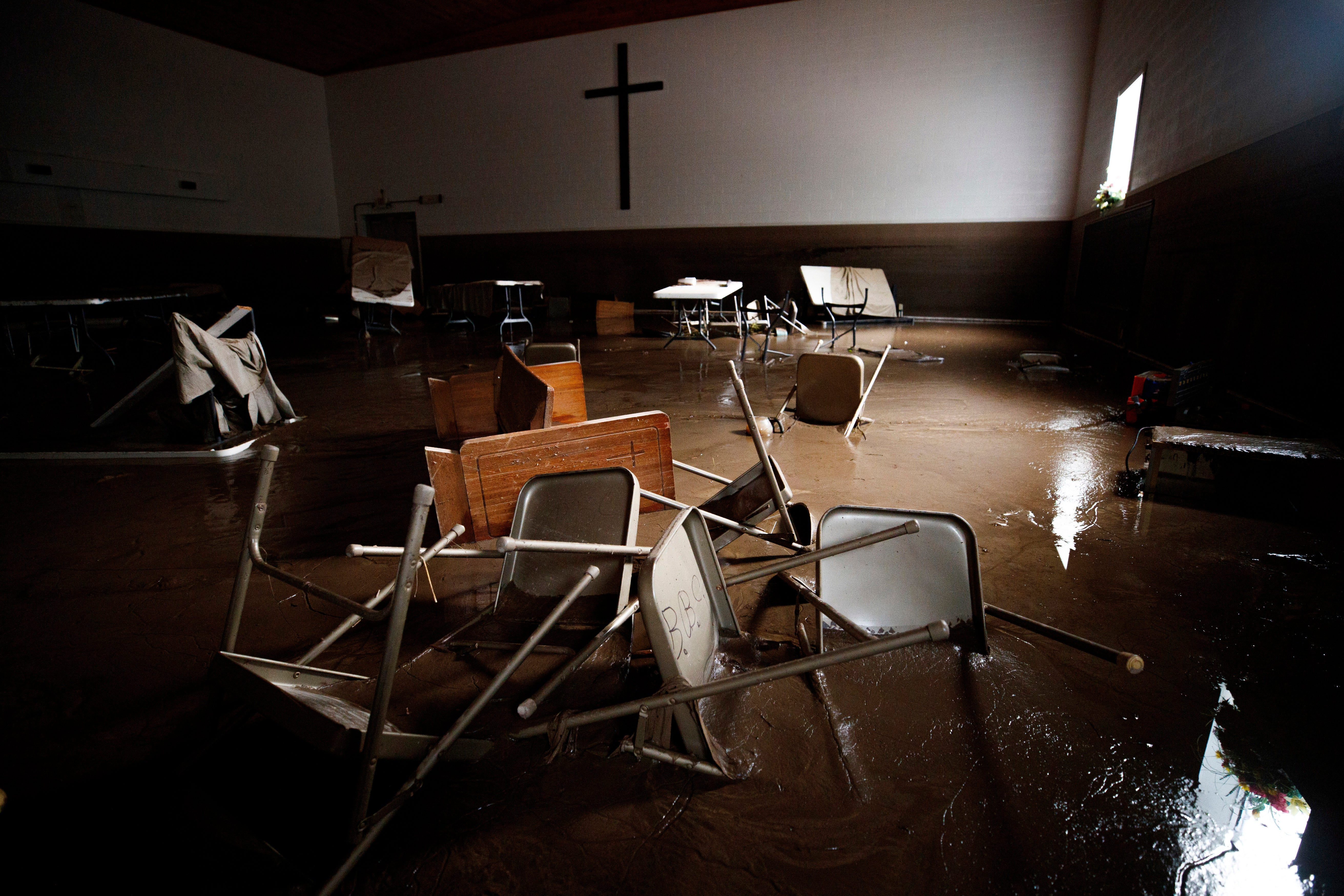 A church sits in disarray with water water damage after floods