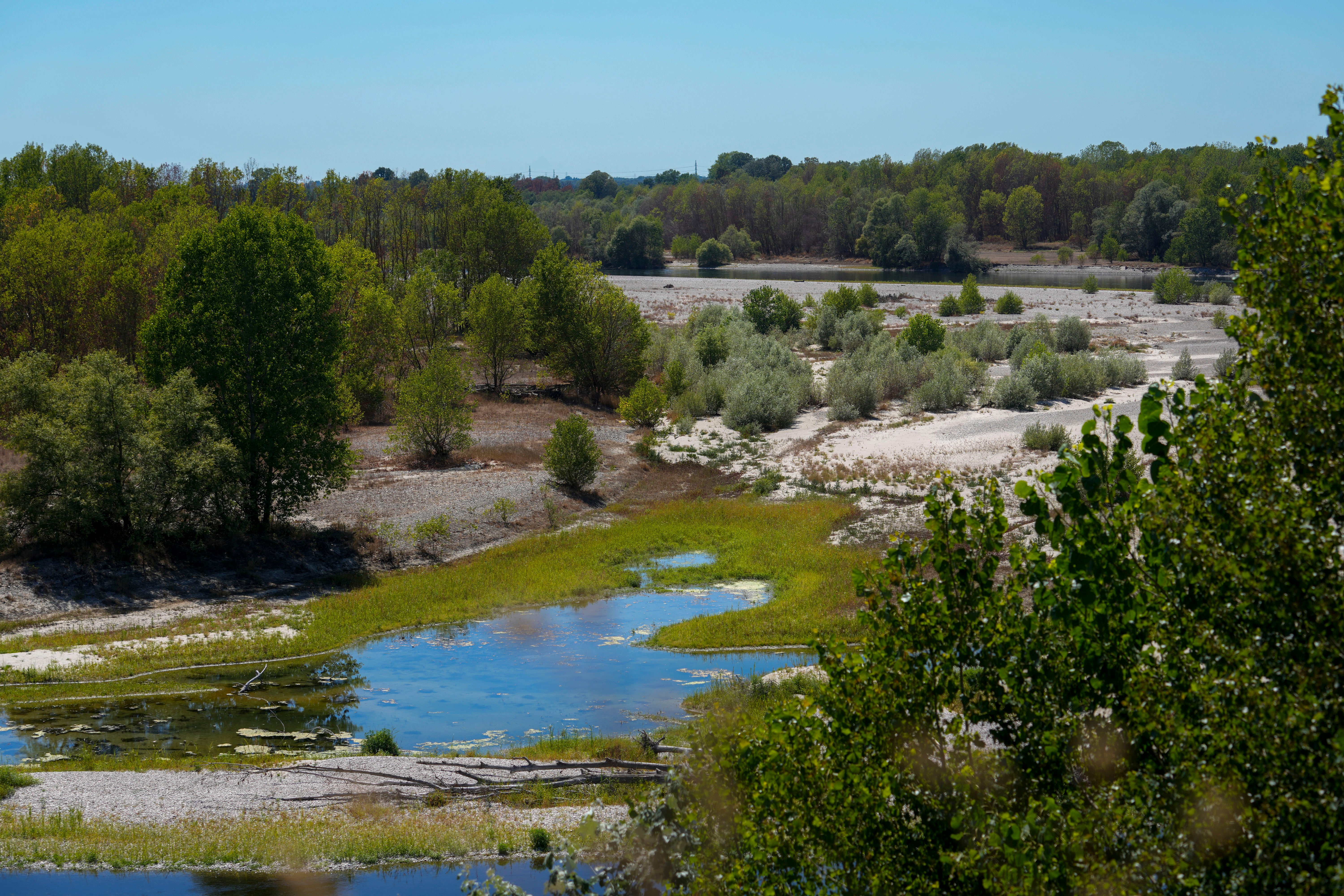 A view of the almost dried-out riverbed of the Ticino River near Torre D’Isola