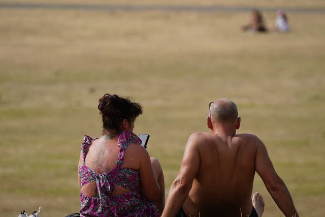 <p>Some are enjoying the hot weather, such as here in Greenwich Park, London, but for others it is causing misery</p>