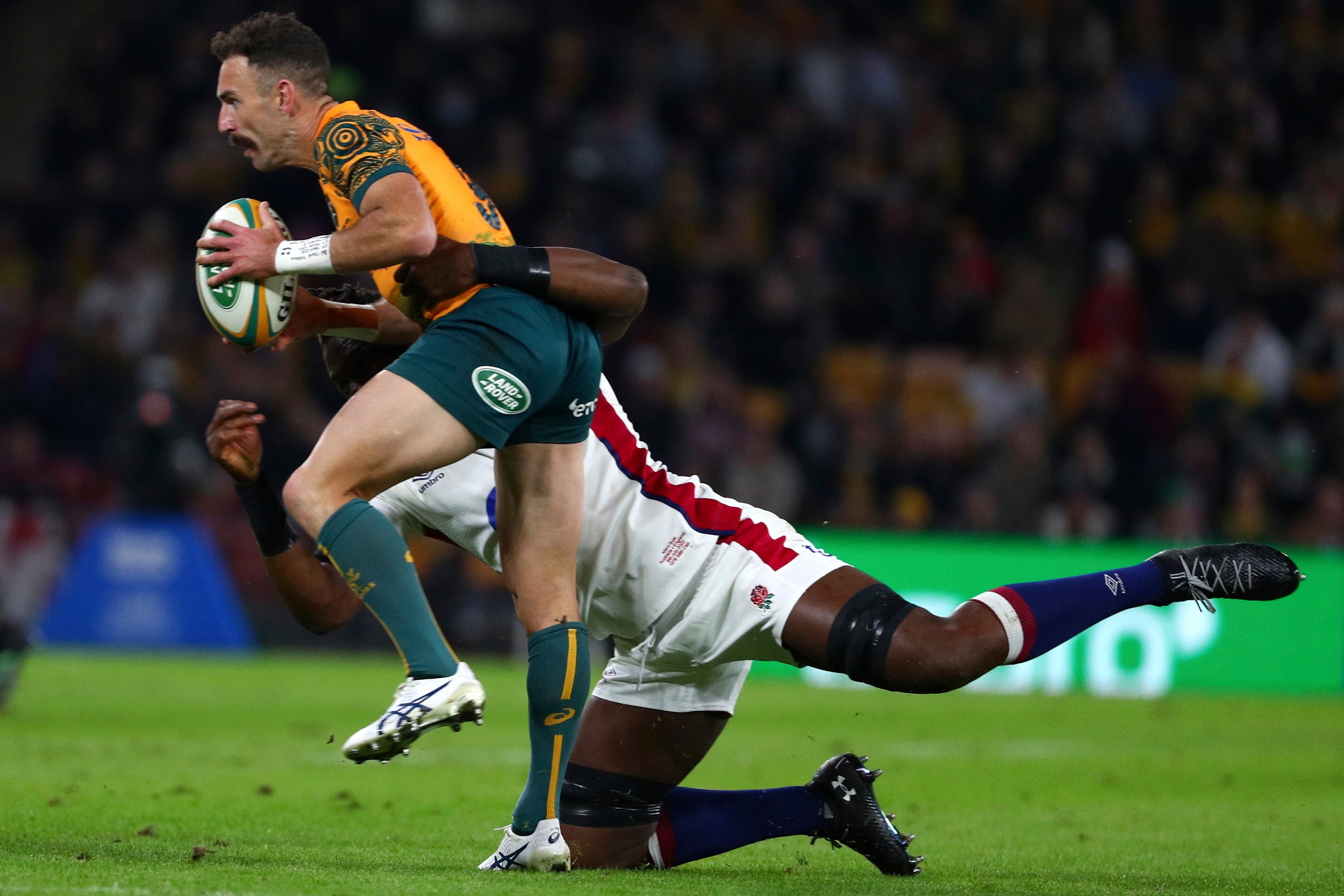 Australia’s Nic White, left, is tackled by England’s Maro Itoje (Tertius Pickard/AP)
