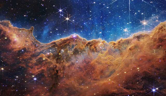 <p>The James Webb Space Telescope image of the Carina Nebula is a composed of data from both the telescopes near and mid-infrared instruments</p>