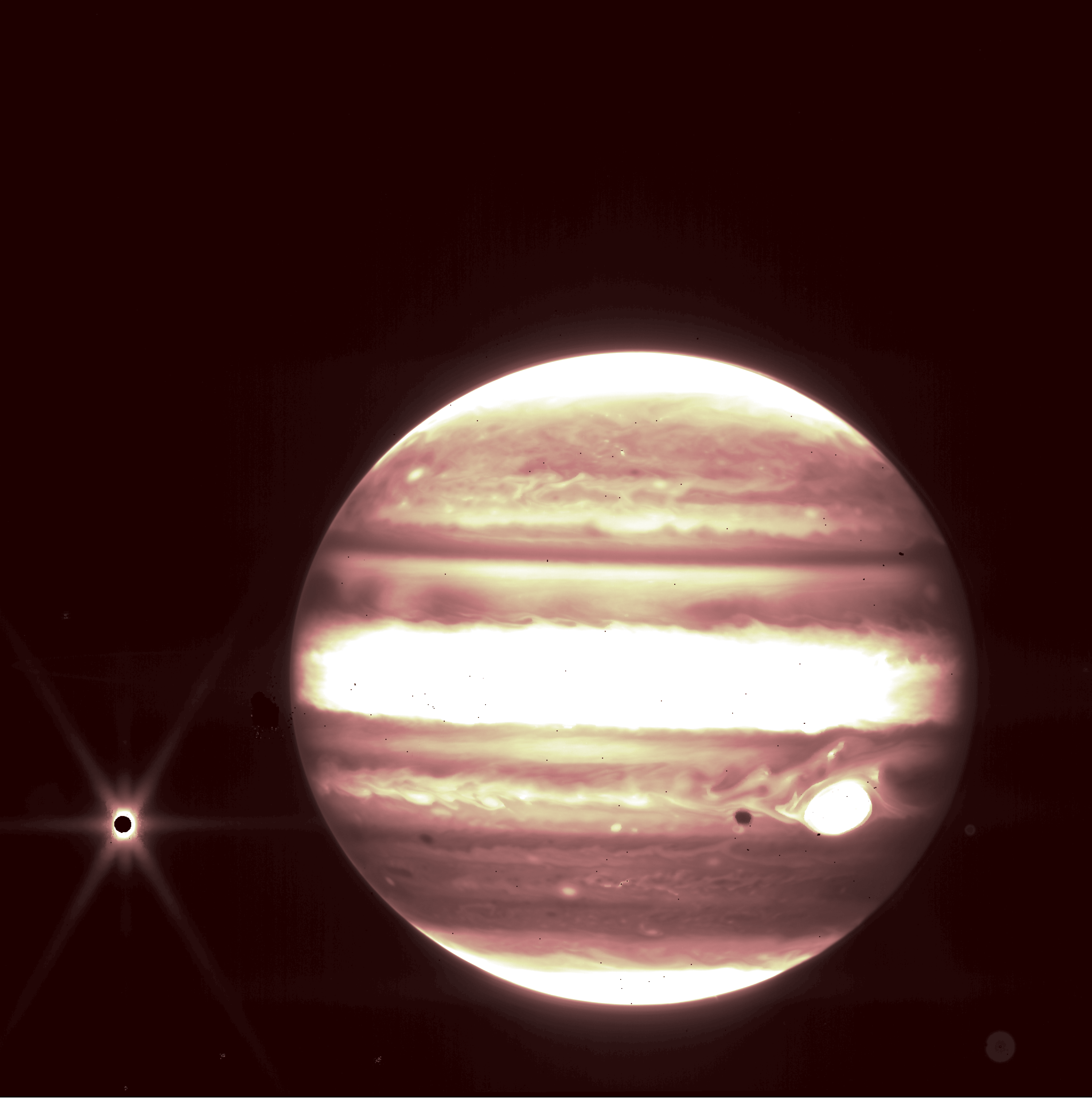 Jupiter as seen in near-infrared light by the James Webb Space Telescope. The Jovian moon Europa is seen at left