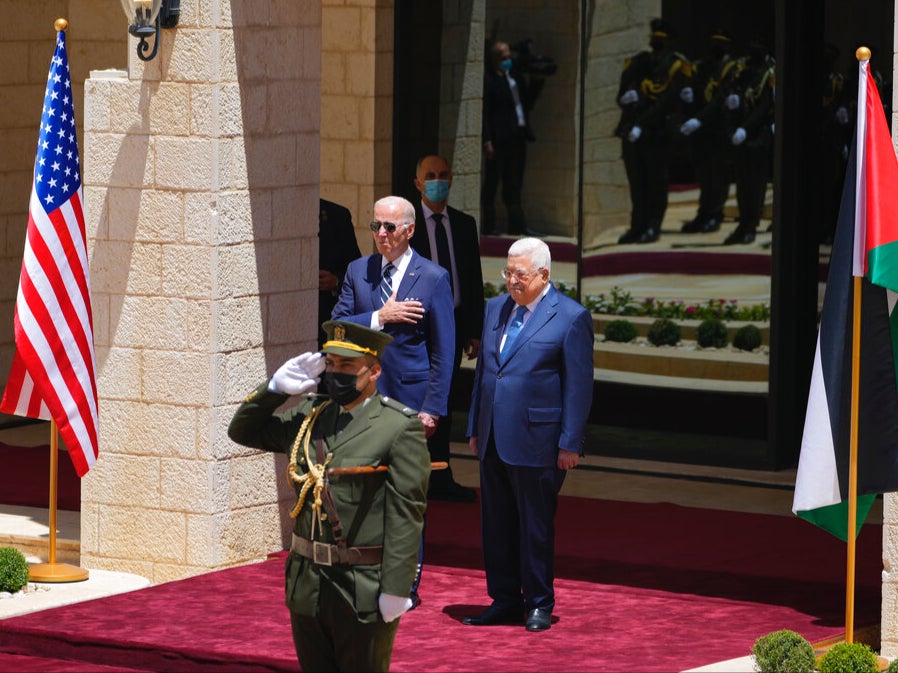 Joe Biden and Mahmoud Abbas listen to the national anthem during a welcoming ceremony in Bethlehem