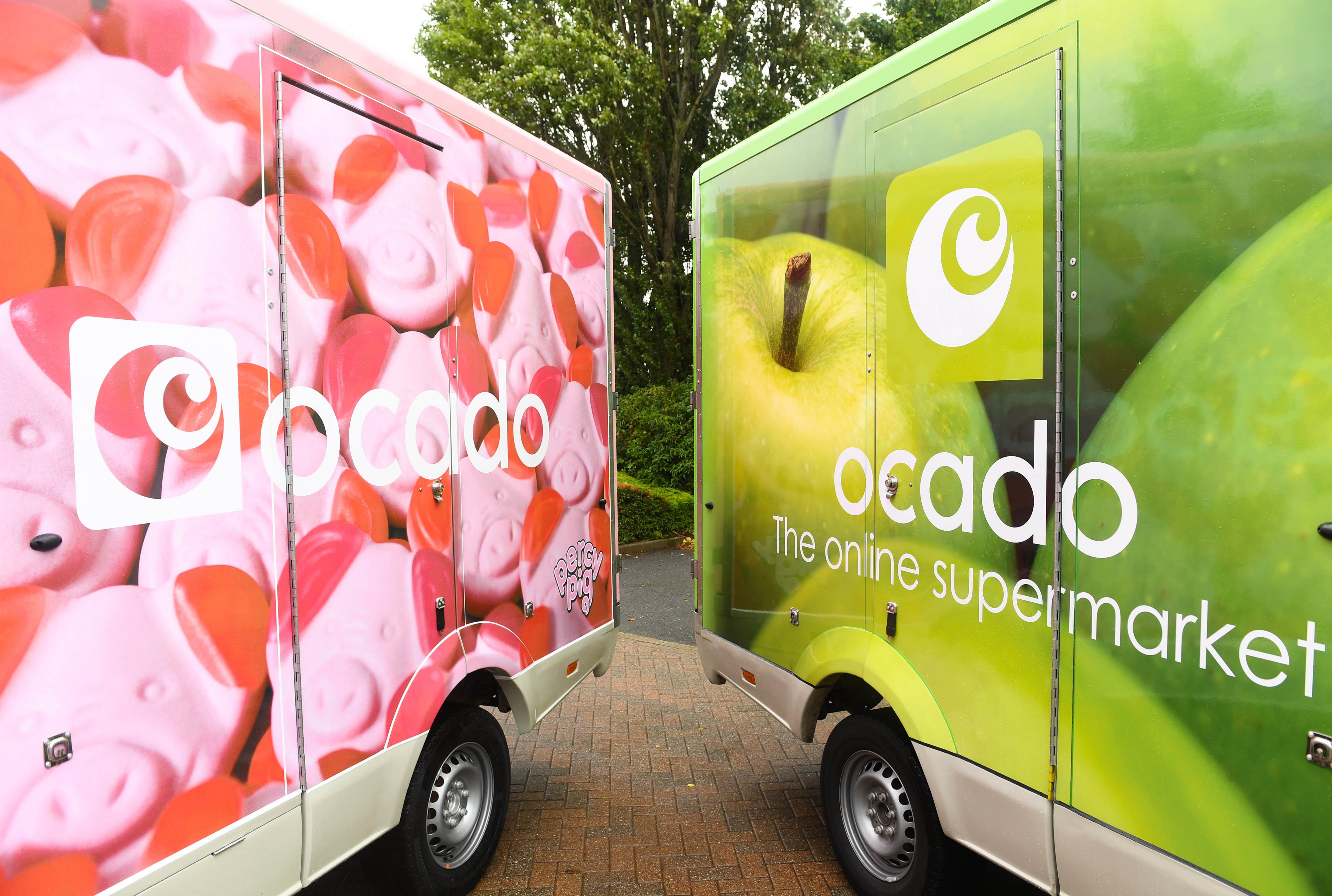 A fleet of Ocado delivery vans