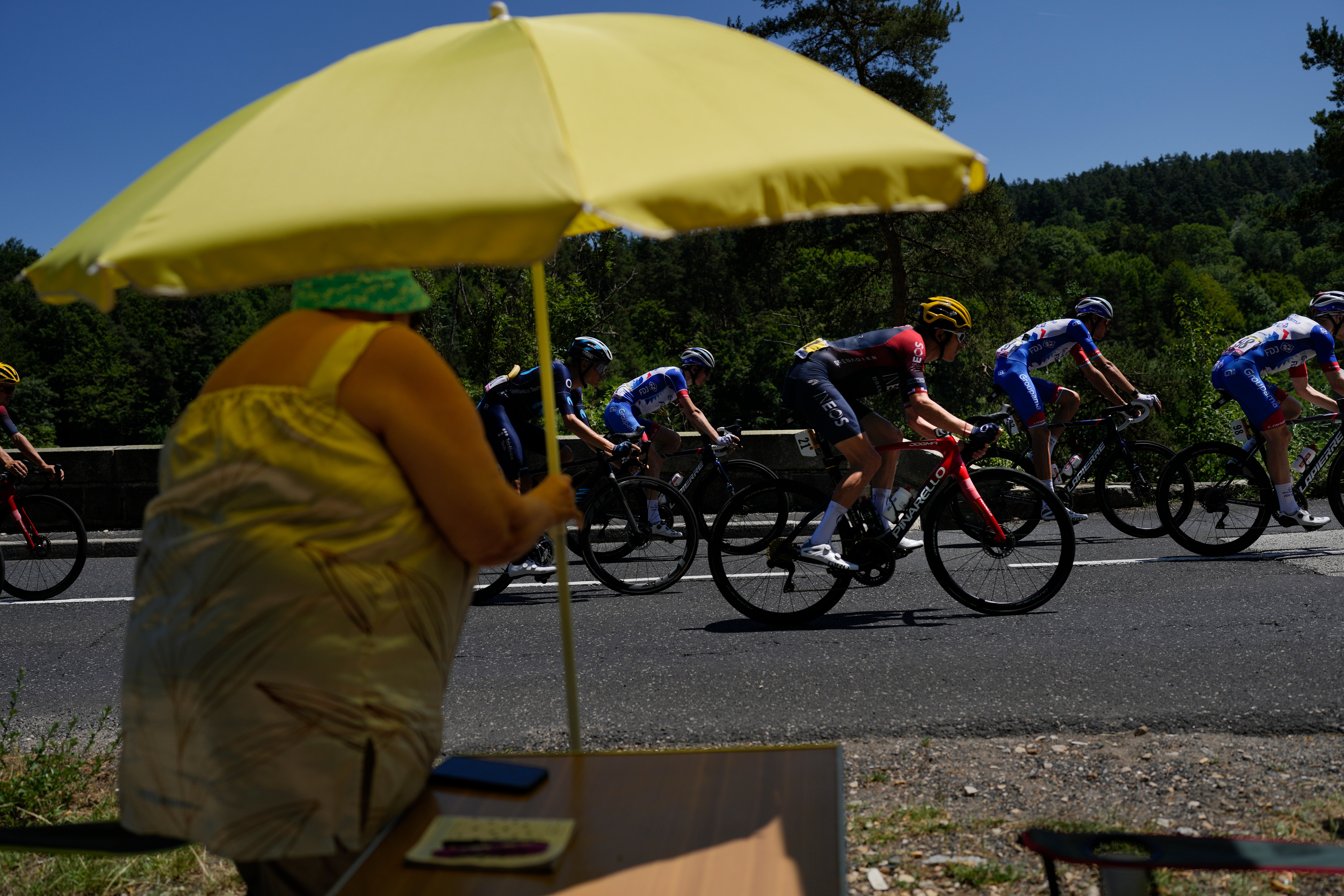 Riders struggled to keep cool in temperatures reaching 40 degrees on Saturday (Thibault Camus/AP)