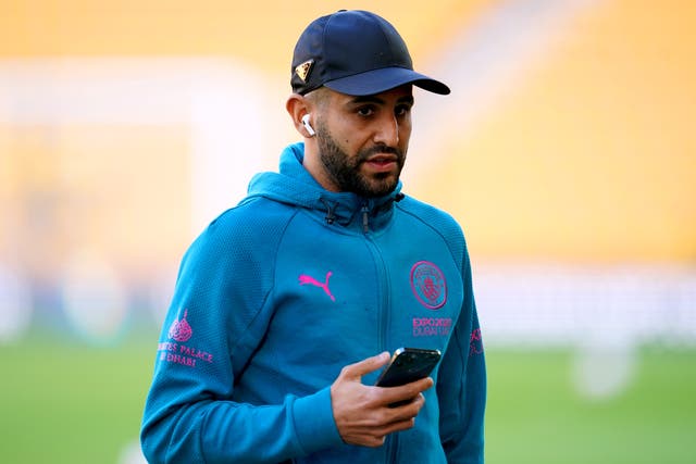 Manchester City’s Riyad Mahrez inspects the pitch ahead of the Premier League match at the Molineux Stadium, Wolverhampton. Picture date: Wednesday May 11, 2022.