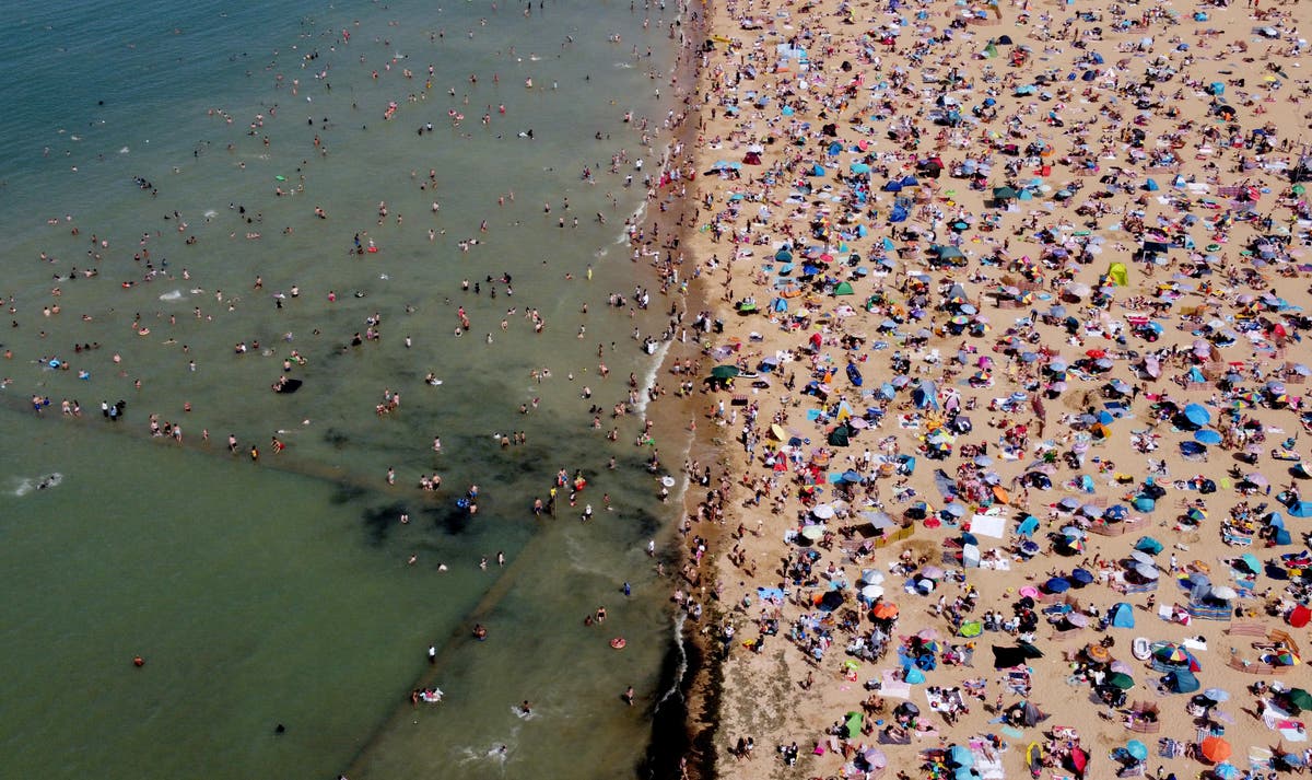 In Pictures: Thousands head to beaches as health boss warns of ‘ferocious heat’