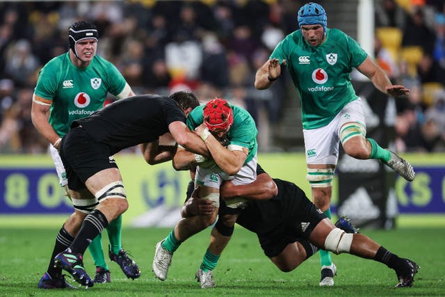 <p>Ireland’s Josh van der Flier is tackled by the All Blacks</p>