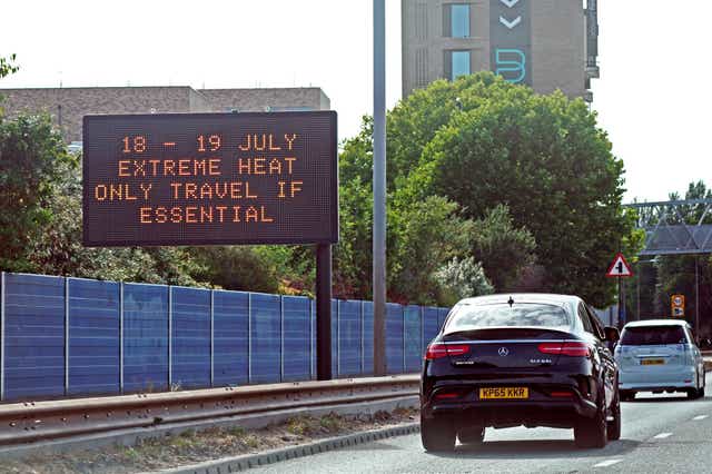 A weather travel warning for Monday and Tuesday is displayed on a road information panel on the A13 near Beckton in east London (Yui Mok/PA)