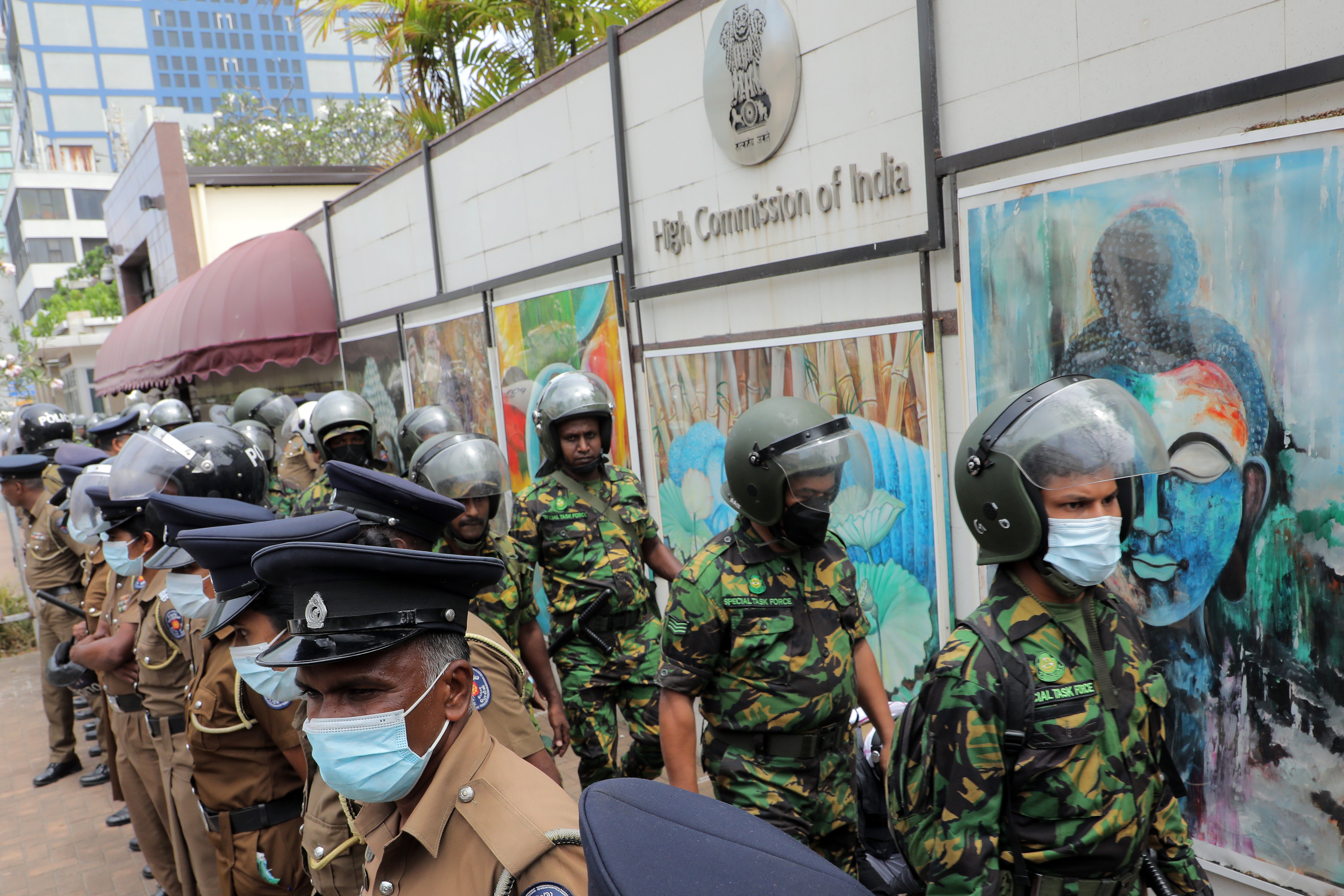 Sri Lankan policemen and Special Task Force (STF) personnel deployed for security in front of the Indian High Commission in Colombo