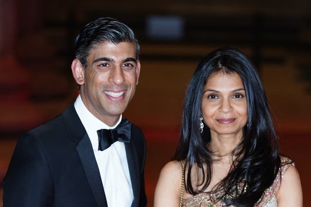 <p>Rishi Sunak with his wife, Akshata Murty, who retained her ‘non dom’ status (Ian West/PA)</p>