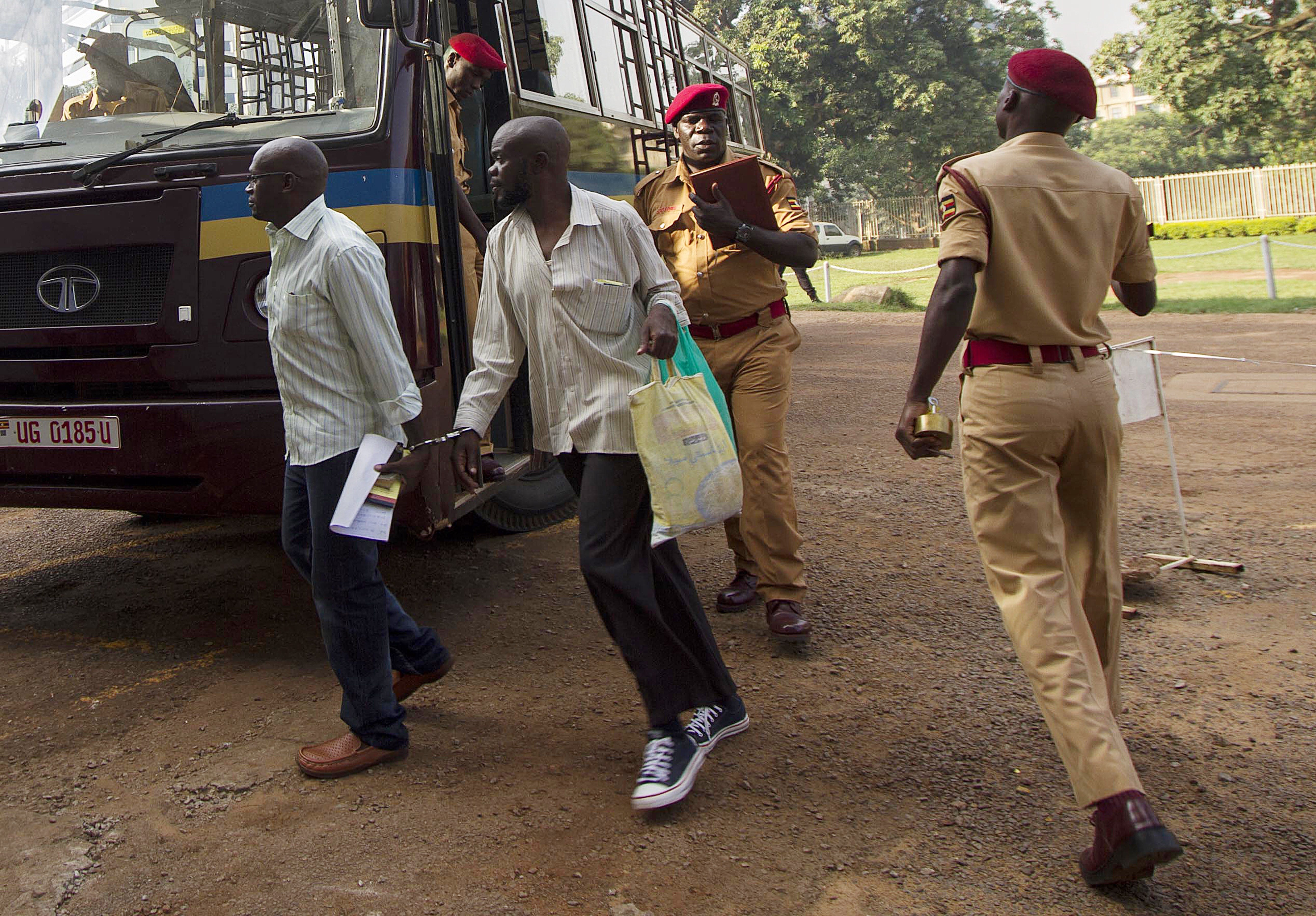 Suspsects in a 2010 terror bomb attack on two pubs during the World Cup final arrive at the Kampala High Court