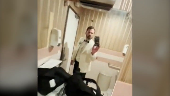 Ben Affleck gets dressed in bathroom for wedding to Jennifer Lopez