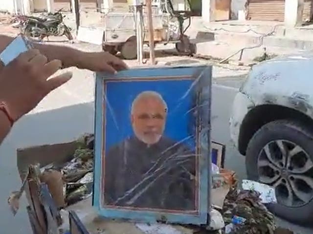 <p>A sanitation worker’s contract was terminated in India’s Uttar Pradesh after photographs of prime minister Narendra Modi and chief minister Yogi Adityanath were found in his garbage cart</p>