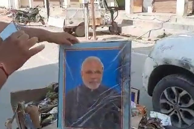 <p>A sanitation worker’s contract was terminated in India’s Uttar Pradesh after photographs of prime minister Narendra Modi and chief minister Yogi Adityanath were found in his garbage cart</p>