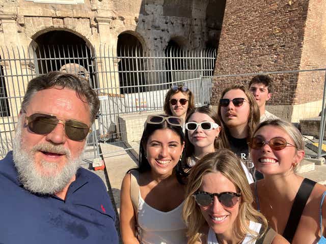<p>Russell Crowe with his family outside Rome’s Colosseum</p>