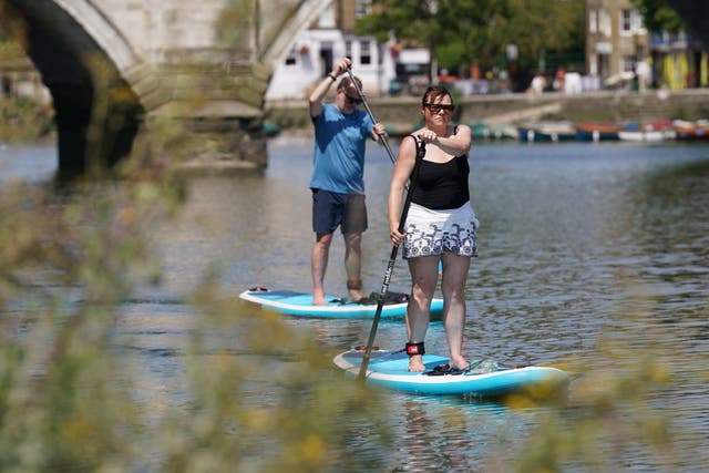 <p>Paddleboarders on the River Thames near Richmond. The area was named as the happiest place to live </p>