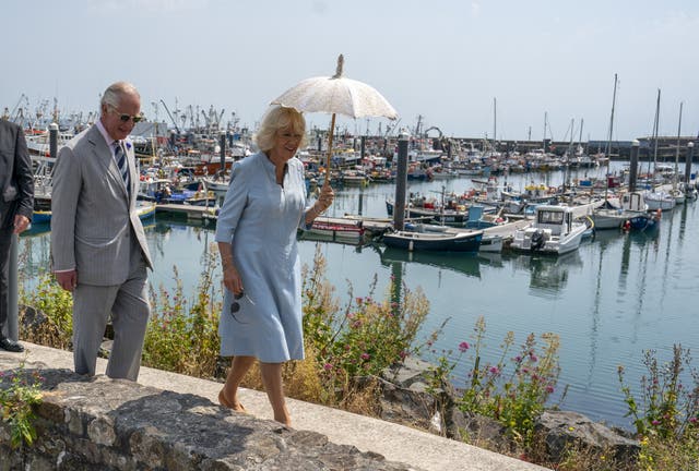 The Prince of Wales and the Duchess of Cornwall during a visit to Newlyn harbour and fishing port in Corwall on the first day of their annual visit to the South West (Arthur Edwards/The Sun/PA)