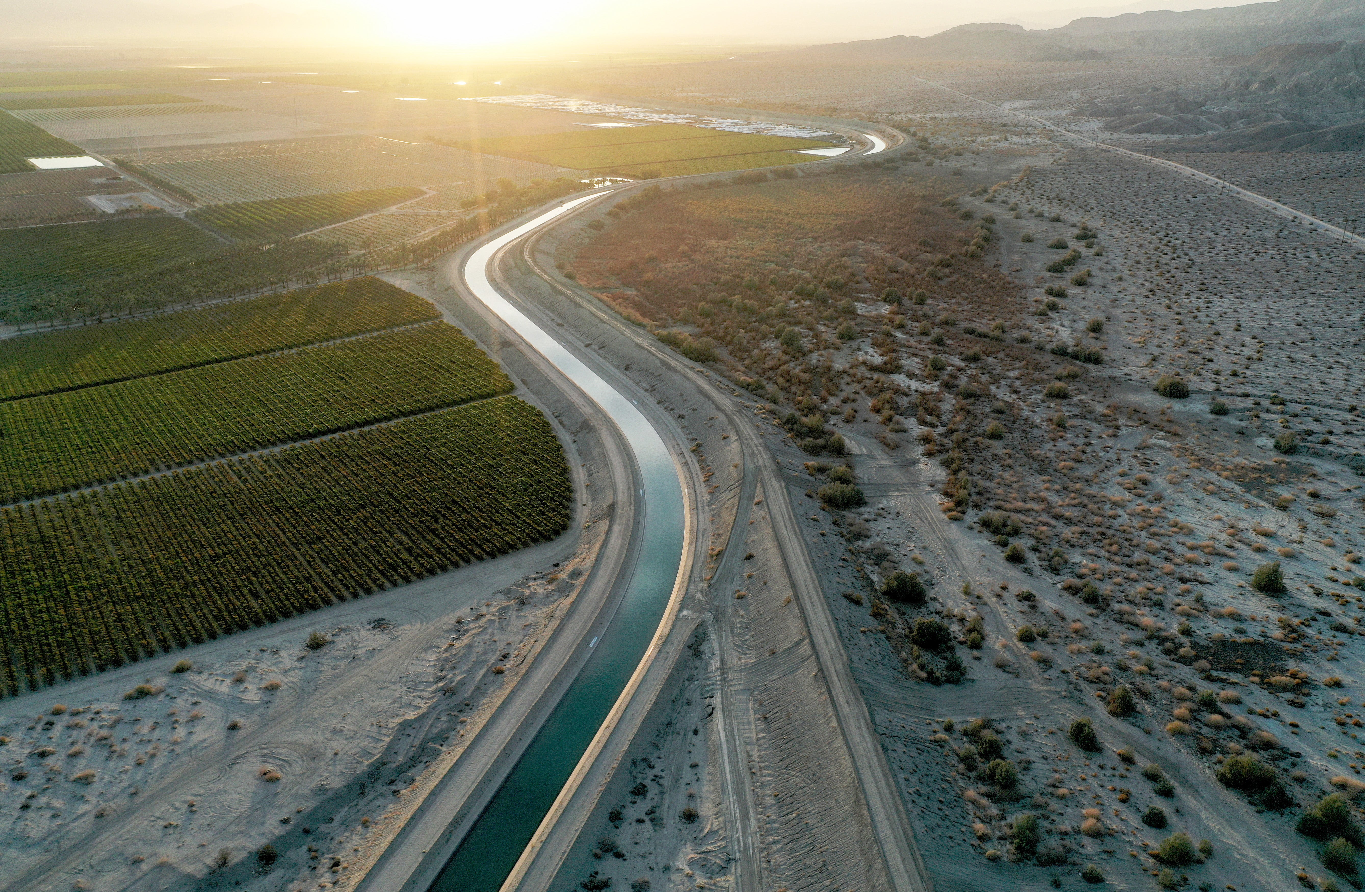 Aerial view of the Coachella Canal running past agricultural fields next to undeveloped desert near Mecca, California. More than 97 per cent of California's land area is in at least severe drought status, with nearly 60 per cent in at least extreme drought