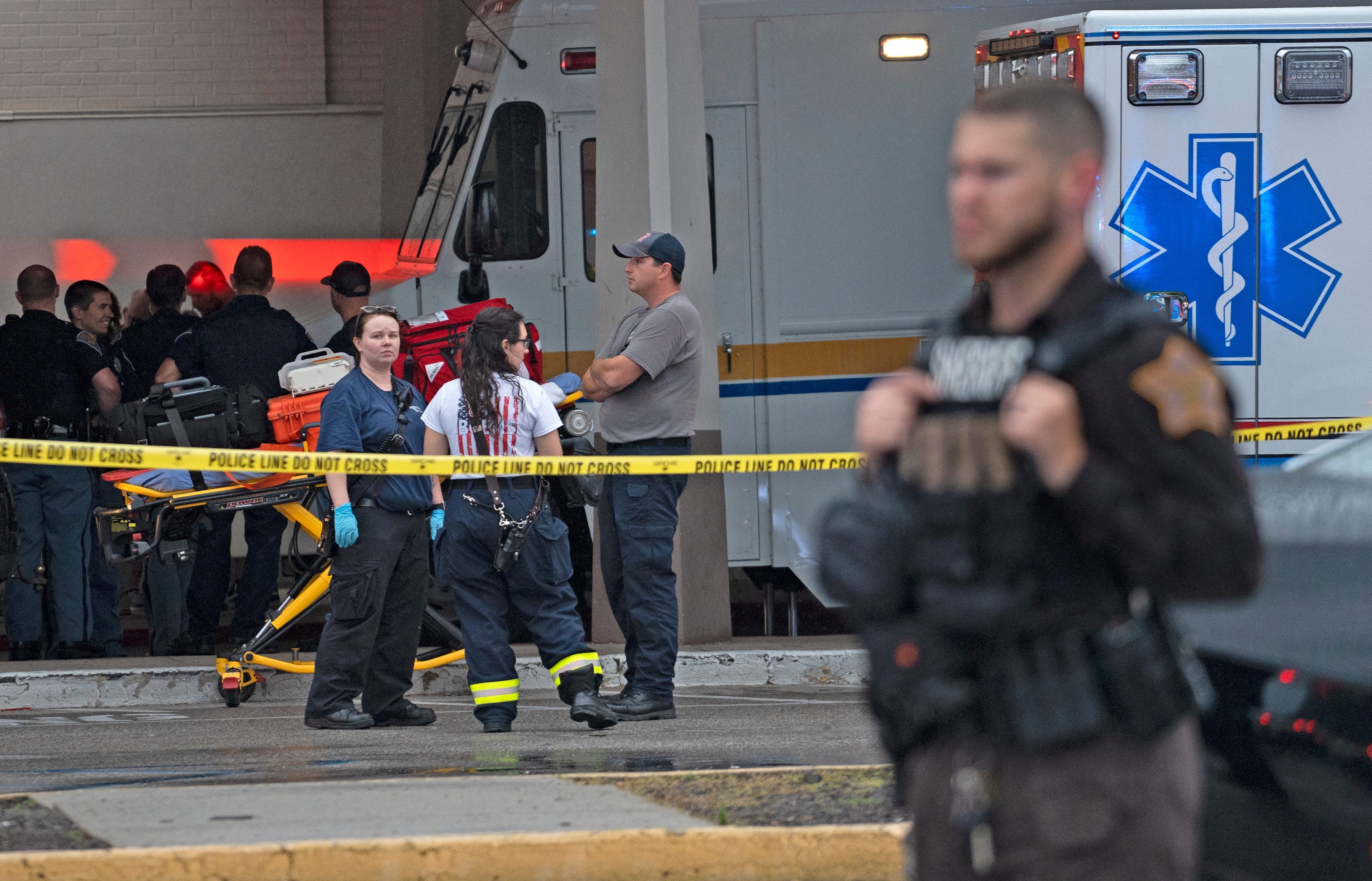 Emergency personnel gather after a shooting at a mall in Greenwood, Indiana, on Sunday