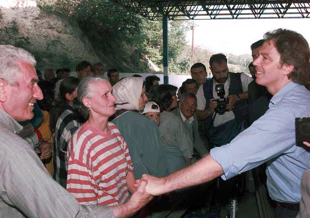 Prime Minister Tony Blair meets Kosovan refugees at the border crossing point between Kosovo and Macedonia, near Skopje (John Stillwell/PA)