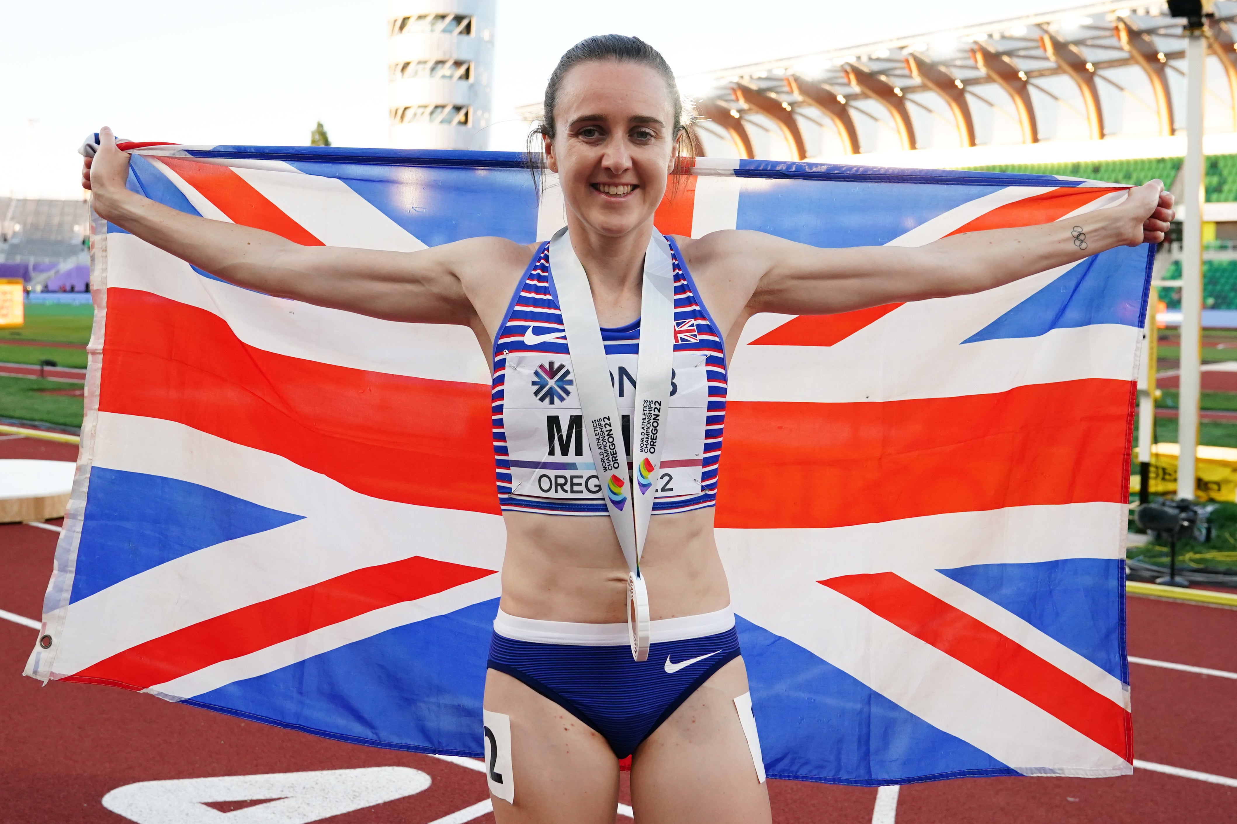 Great Britain’s Laura Muir shows off her bronze medal