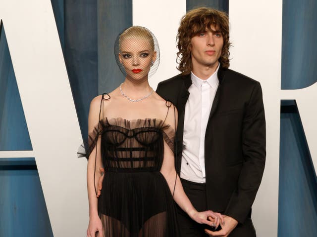 <p>Anya Taylor-Joy and partner Malcom McRae at the Vanity Fair Oscar Party in March 2022</p>