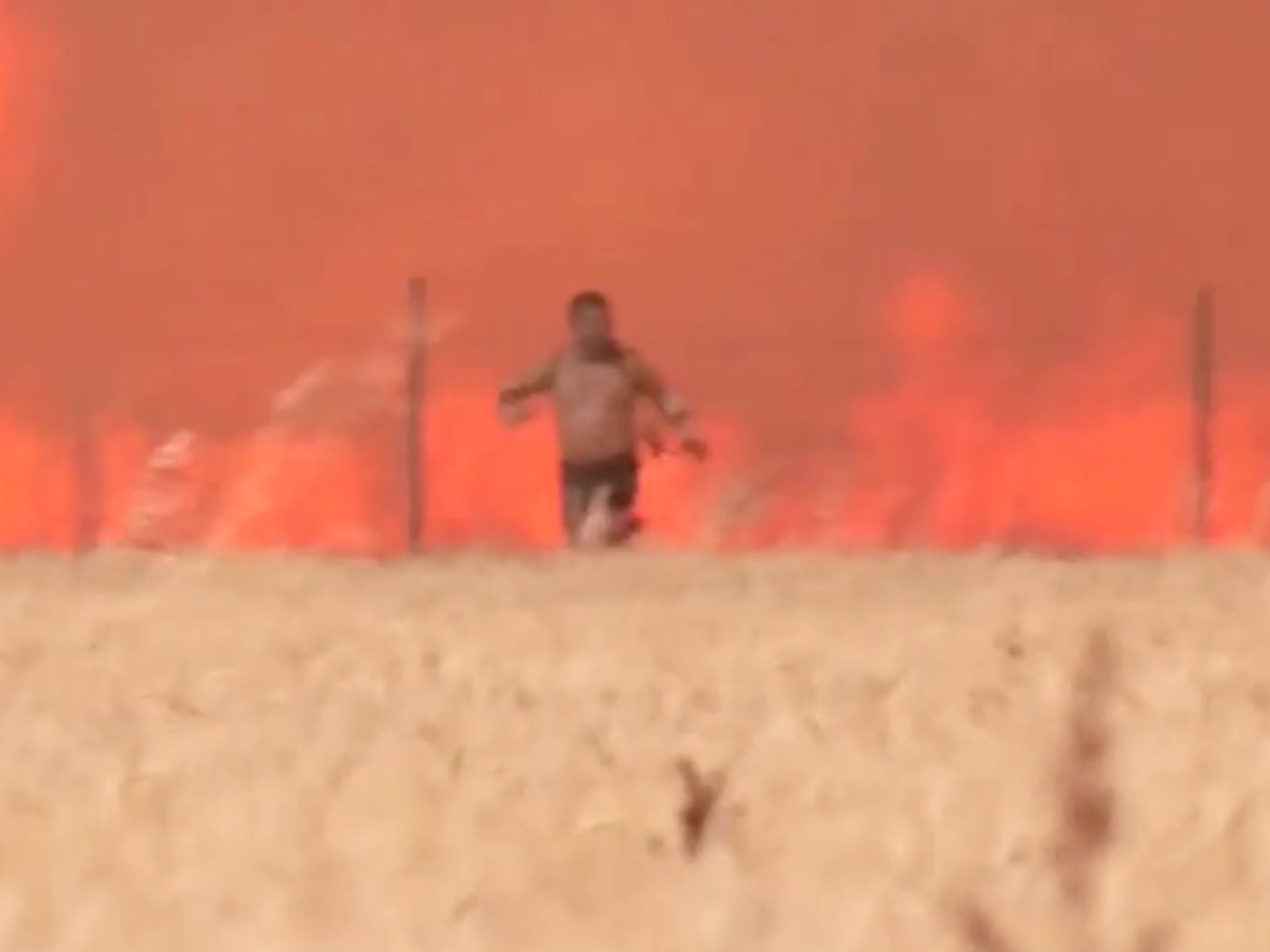 Angel Martin Arjona escapes the wildfire in Tabara, in the Zamora region of Spain