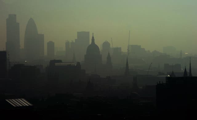 <p>St. Paul’s Cathedral is seen among the skyline through smog in 2011 </p>