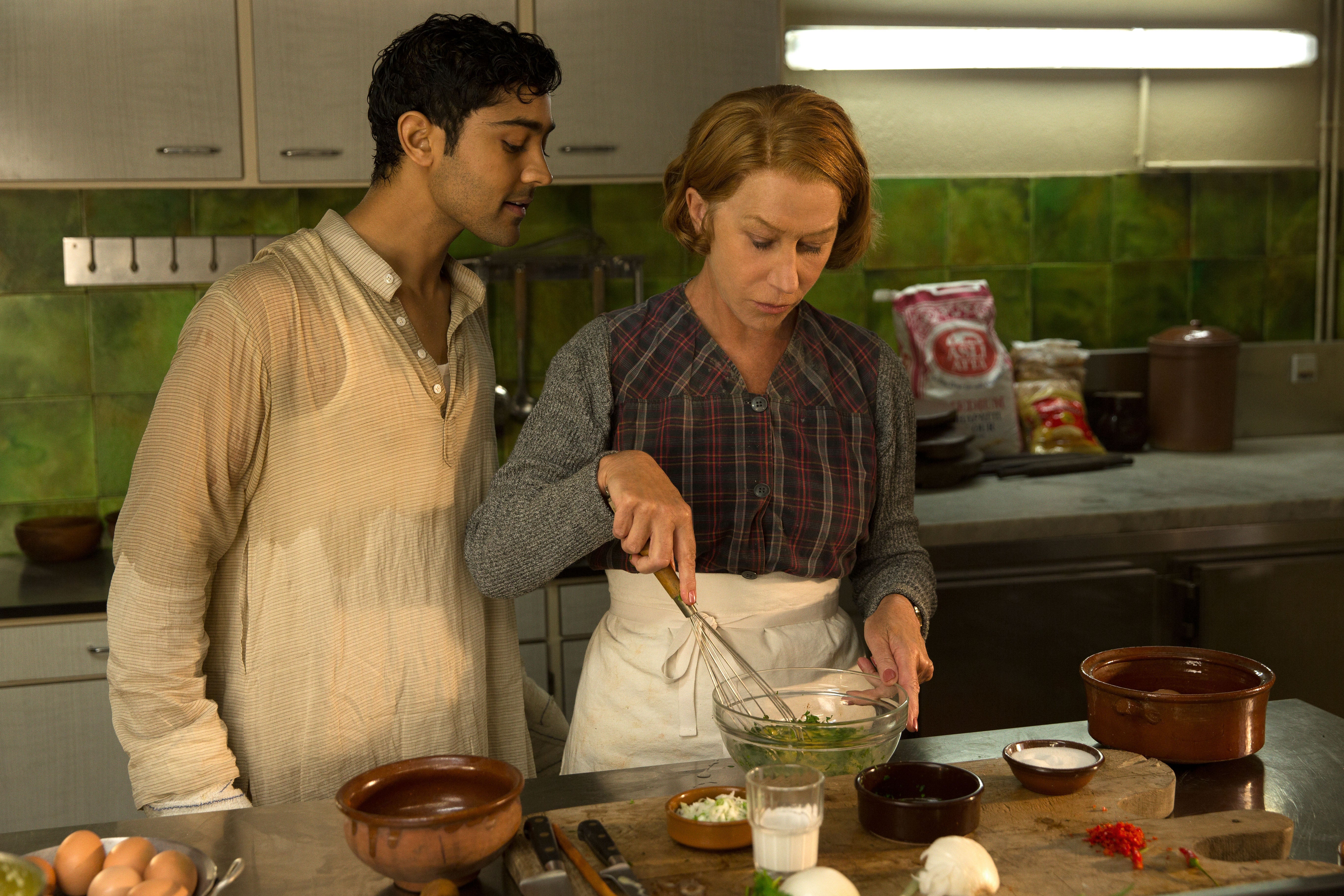 Manish Dayal (left) as Hassan Haji and Helen Mirren as Madame Mallory in The Hundred-Foot Journey (2014)