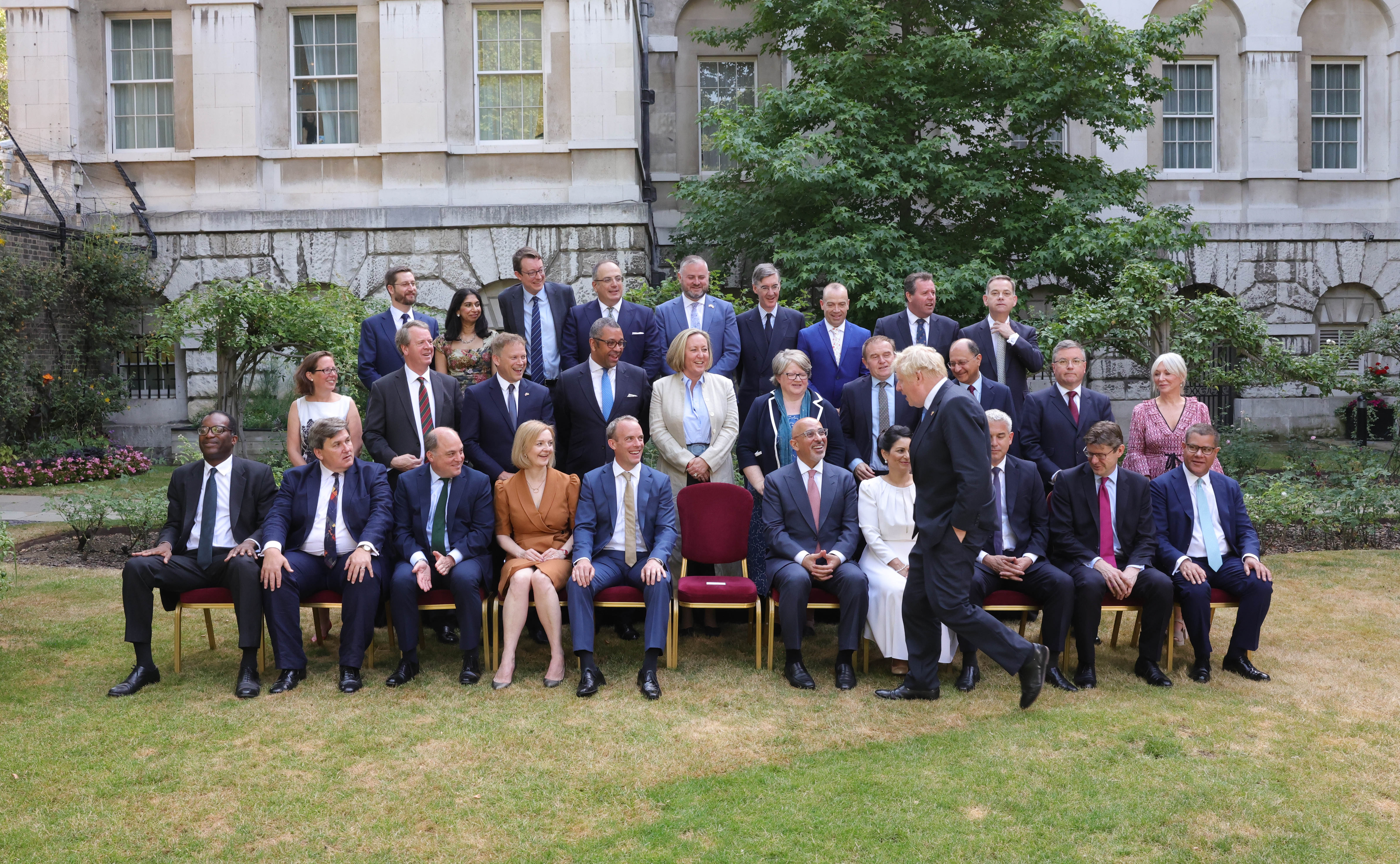 Boris Johnson arrives for a farewell photograph with cabinet ministers