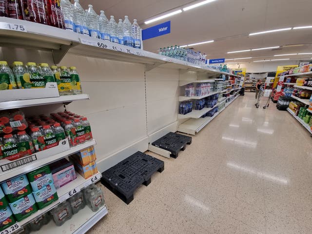 <p>Empty water shelves were seen at Tesco in Clevedon as the UK prepared for another day of hot weathe</p>