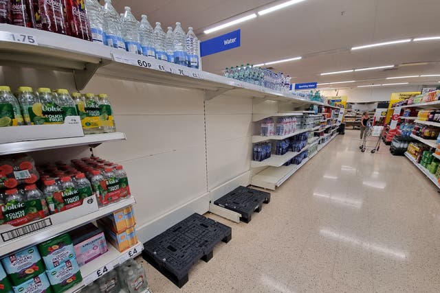 <p>Empty water shelves were seen at Tesco in Clevedon as the UK prepared for another day of hot weathe</p>