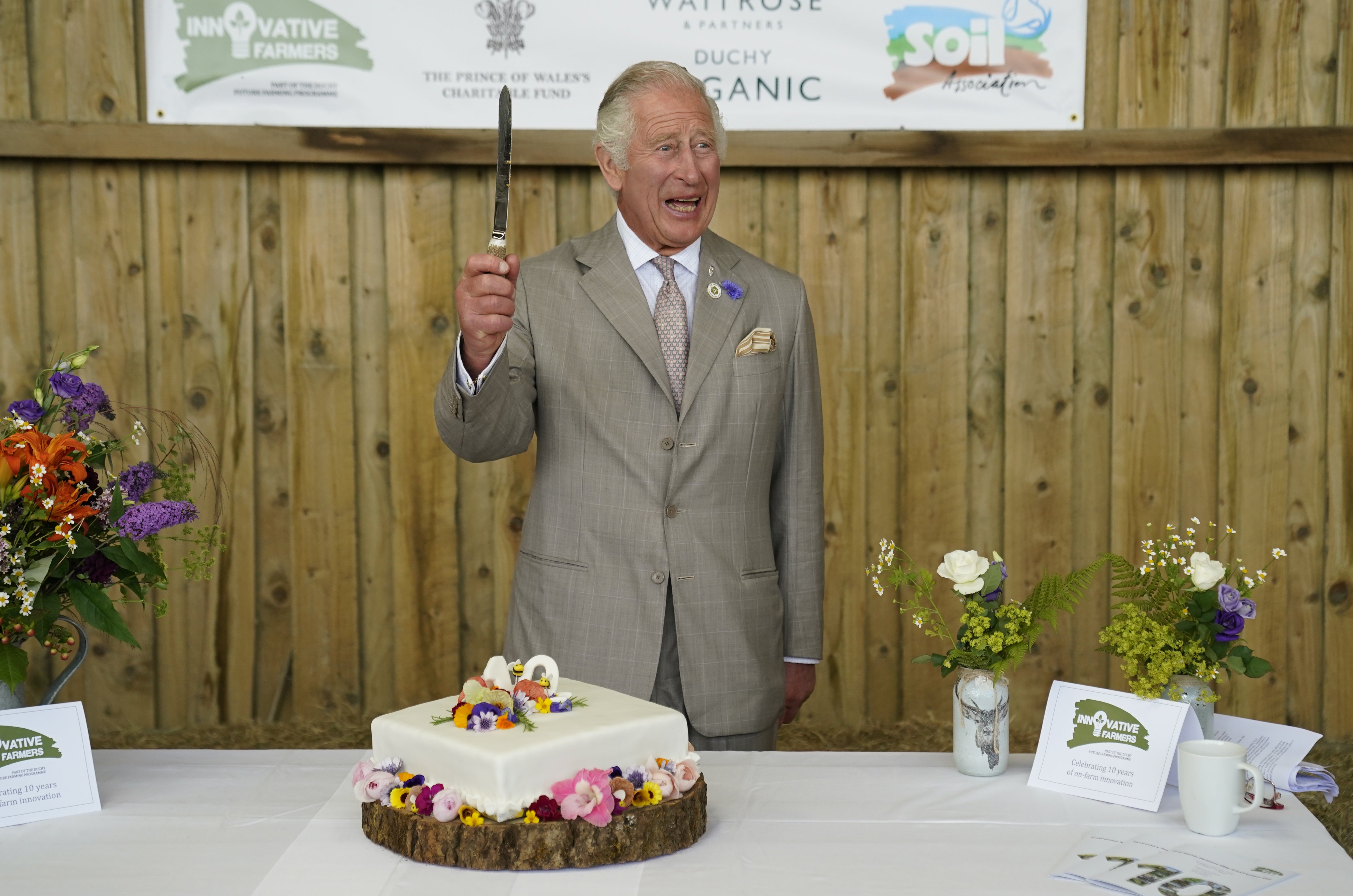 The Prince of Wales cuts a celebratory cake as he attends the Innovative Farmers 10th anniversary at Trefranck Farm, near Launceston (Andrew Matthews/PA)