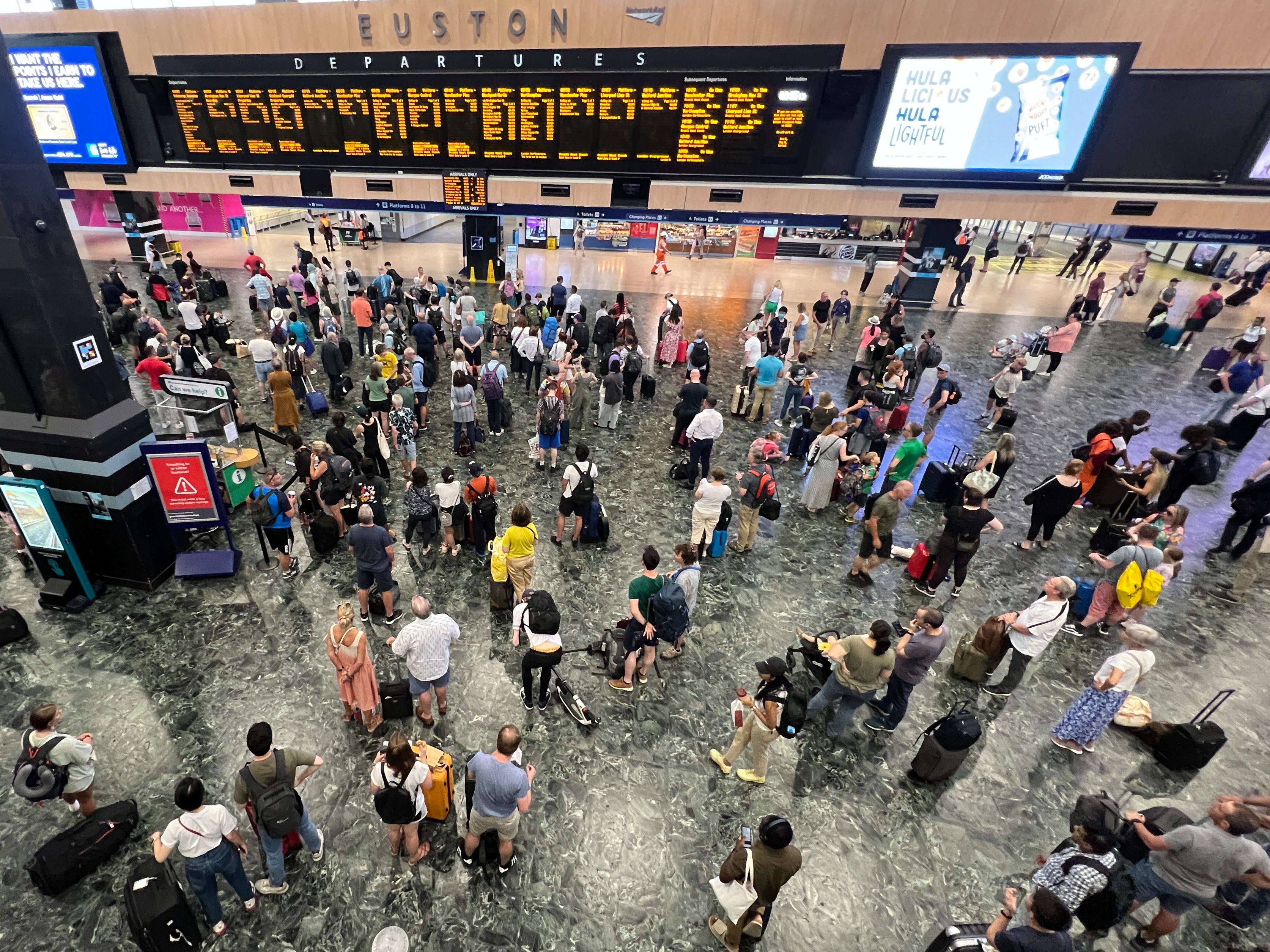 Going places? Rail passengers at London Euston where train services are disrupted