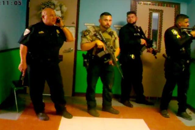 <p>Bodycam shows armed officers and Uvalde School Police Chief Pete Arredondo outside the classroom</p>