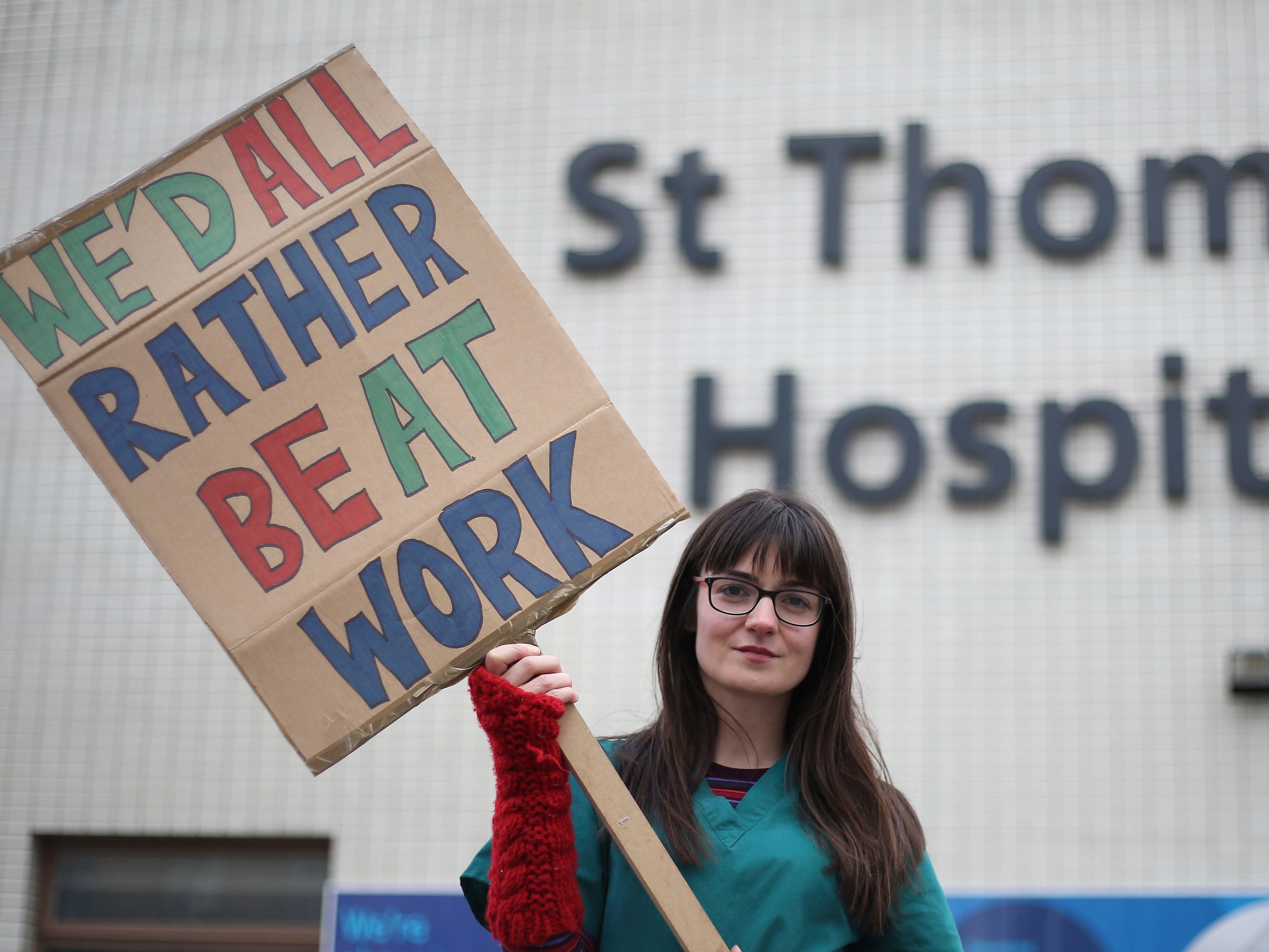 <p>Junior doctor on picket line during previous strike of NHS staff</p>